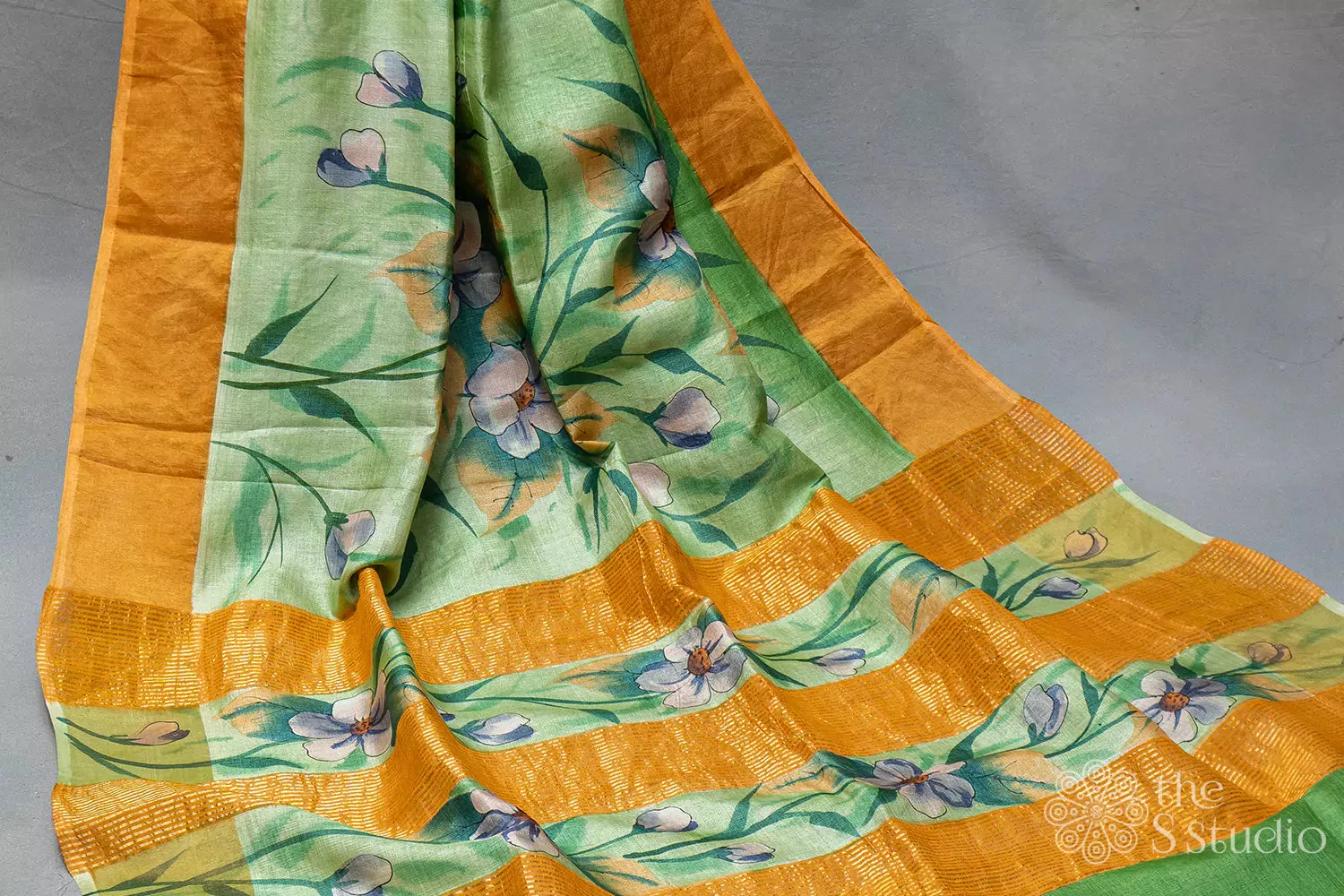 Green printed tussar saree with zari border